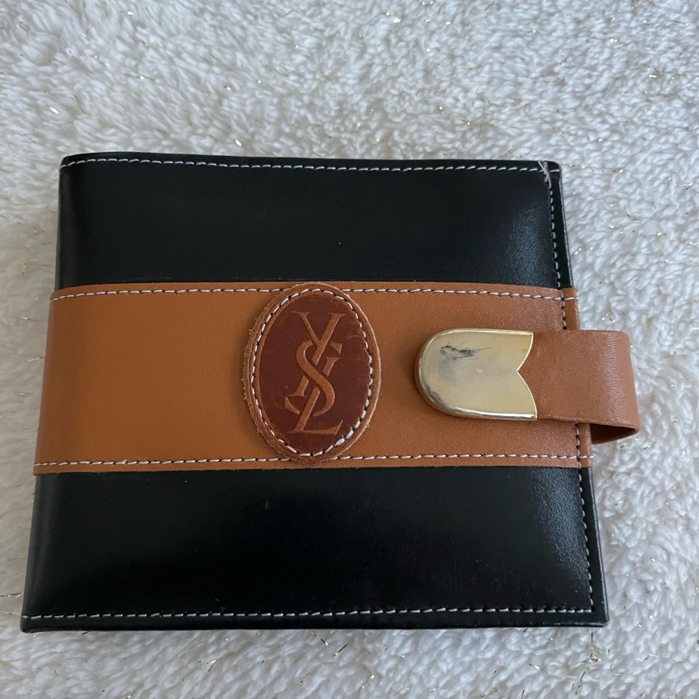 Wallet, black leather with tan trim.